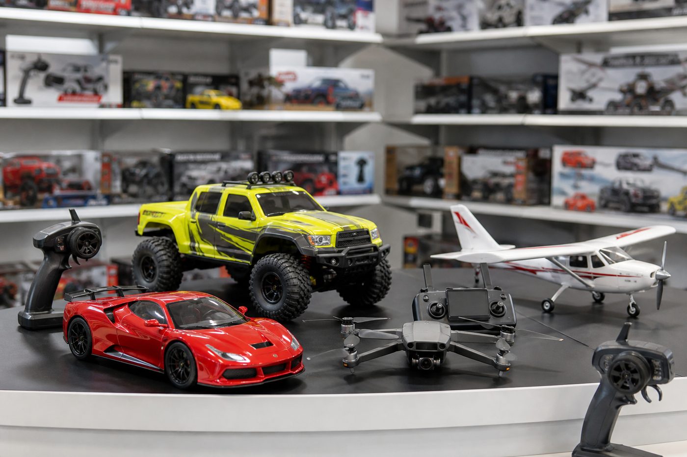 RC cars, drones and transmitters arranged for wholesale review