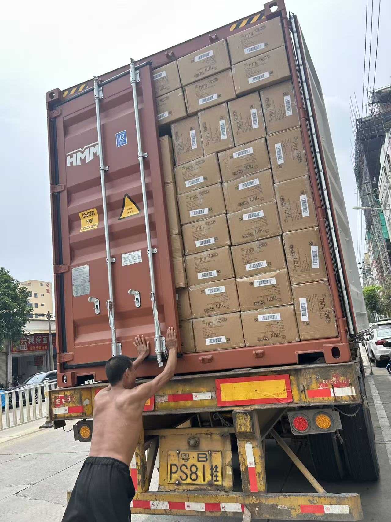 Loaded toy export container being closed in Guangdong