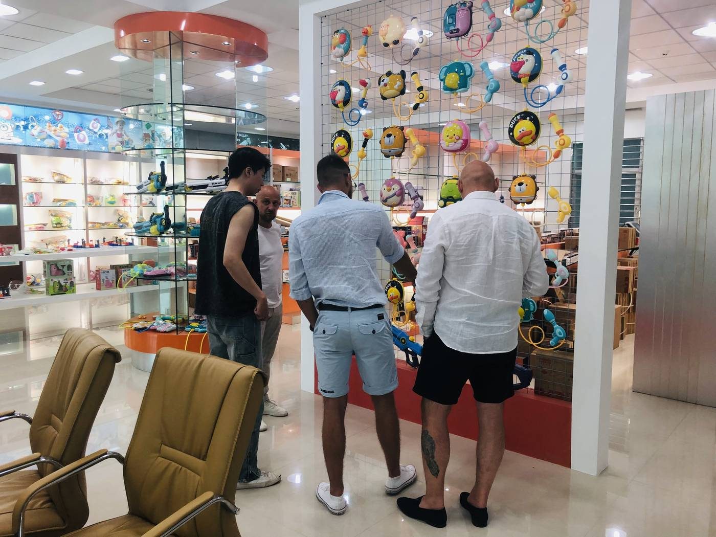 International buyers reviewing water toys in a Chenghai showroom